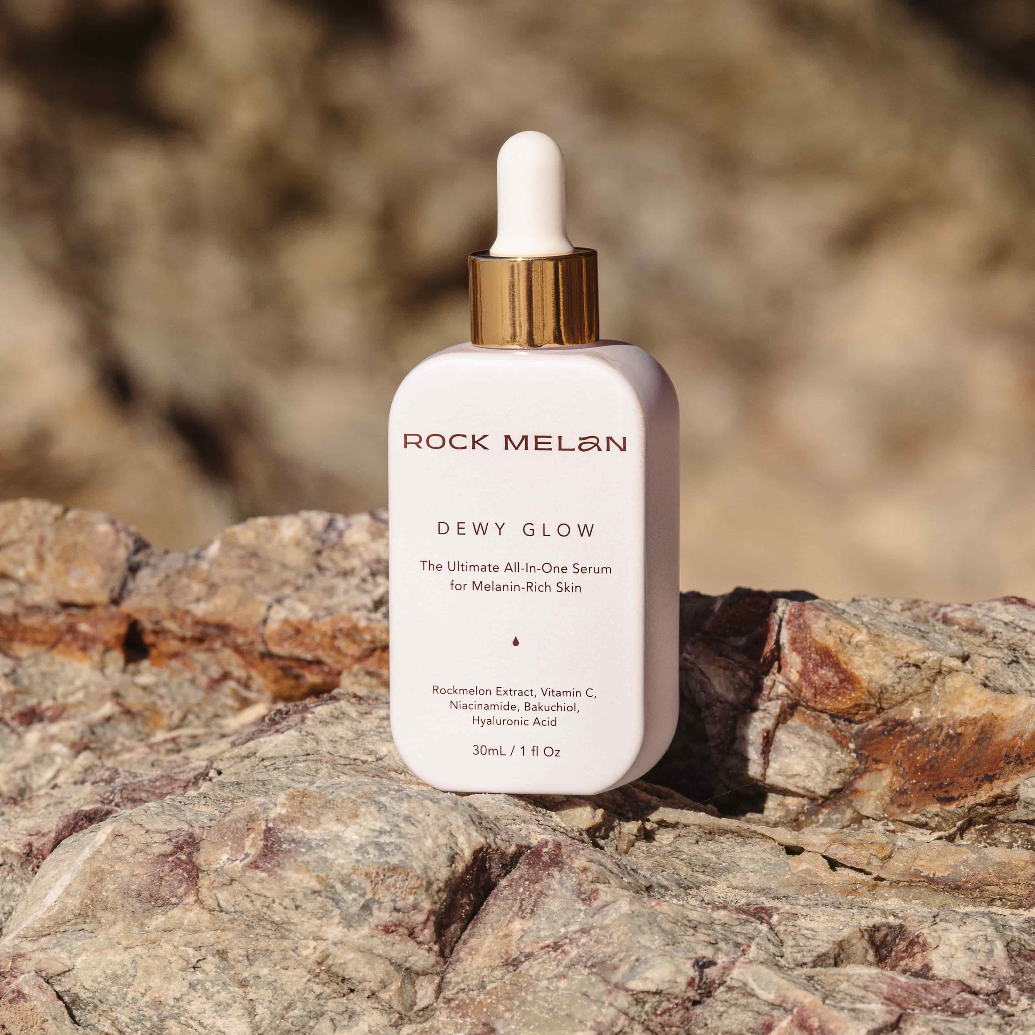 Dewy Glow Serum for Skin of Colour, Bottle on rocks